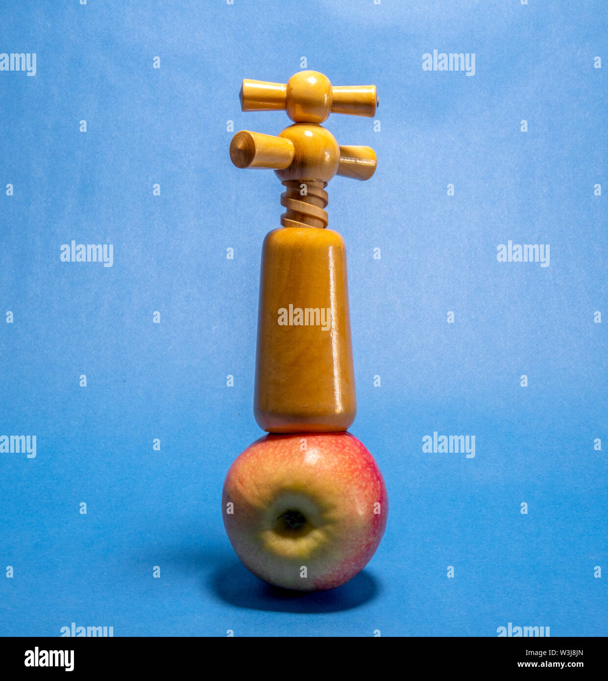 Apple fruit and a corkscrew Stock Photo Alamy