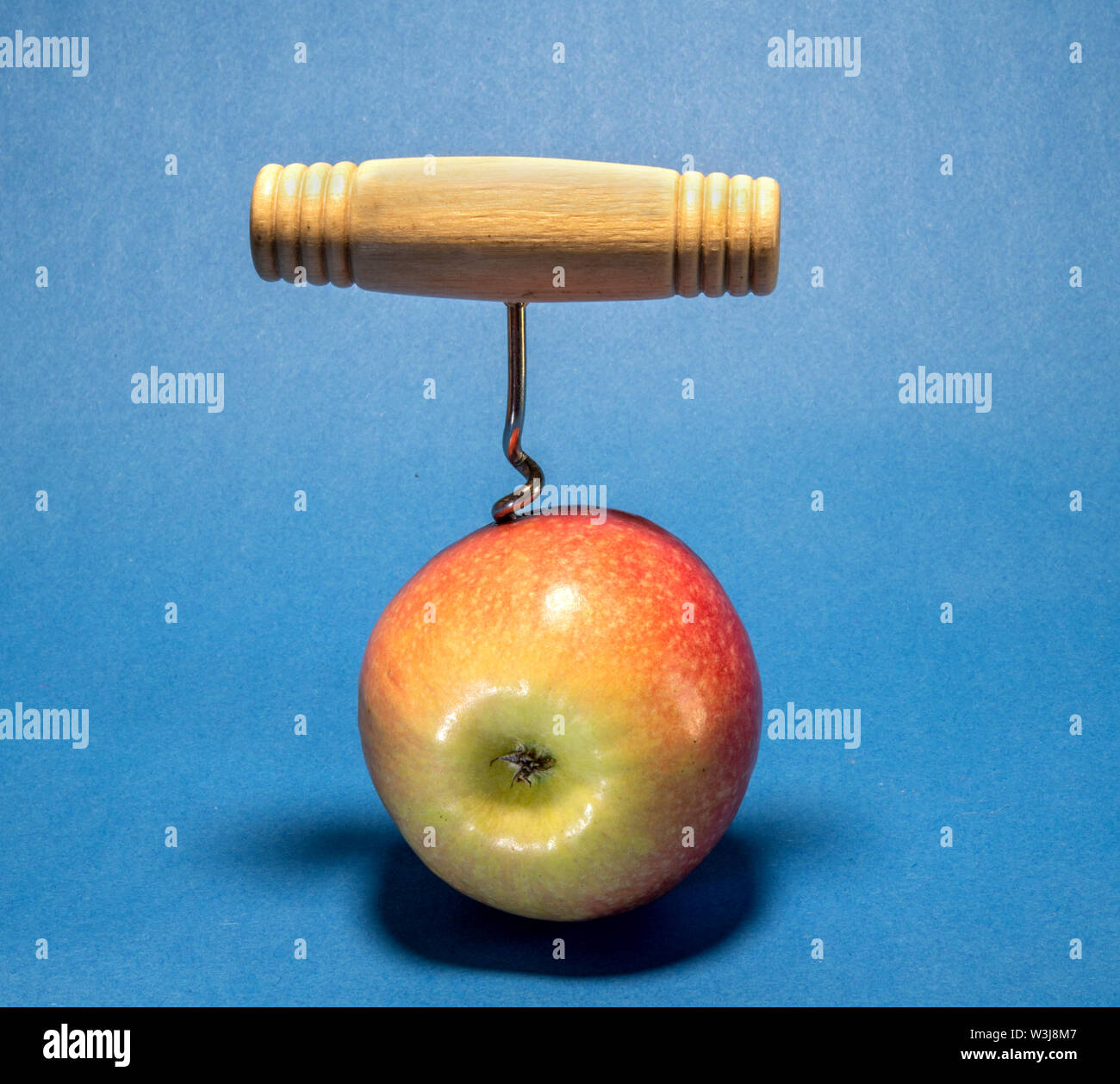 Apple fruit and a corkscrew Stock Photo Alamy