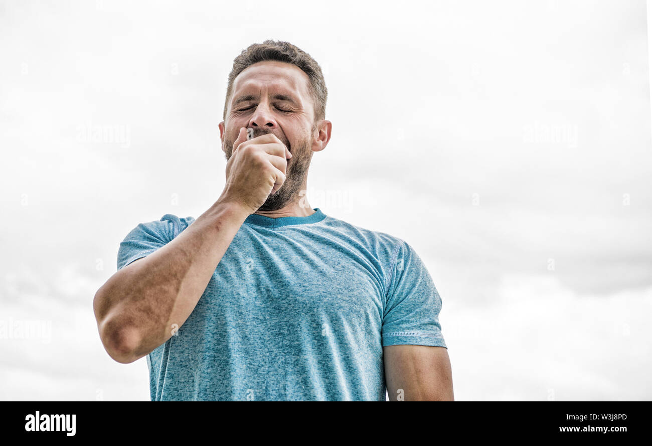 coach in fitness gym. after workout. man athlete in blue sport tshirt
