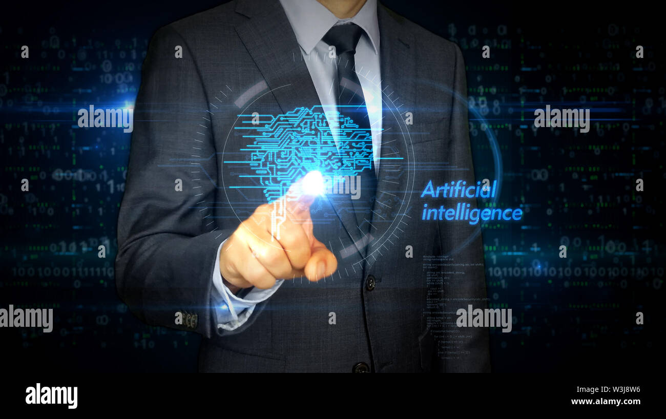 A businessman in a suit touch the screen with cybernetic brain hologram. Man using hand on virtual display interface. Artificial intelligence, machine Stock Photo