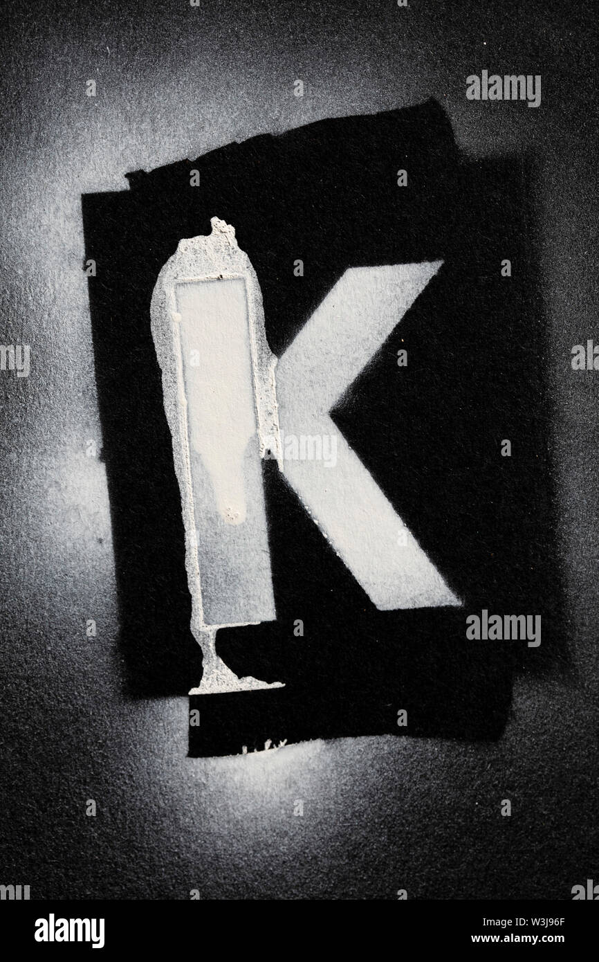 Letter K grunge spray paninted stencil font Stock Photo