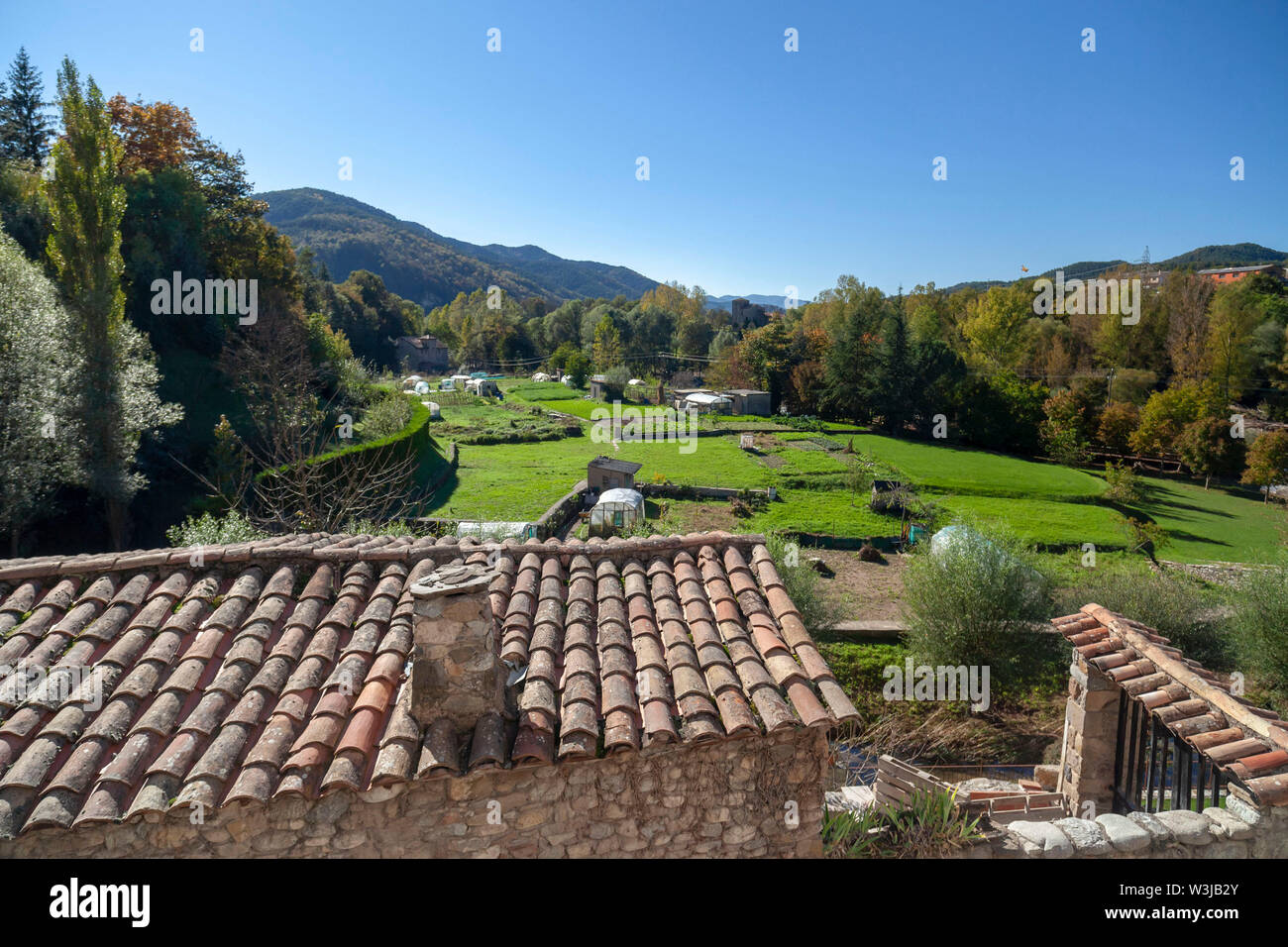 Sant Joan de les Abadesses, Catalonia, Spain. Landscape pyrenees mountain and rural village houses. Stock Photo