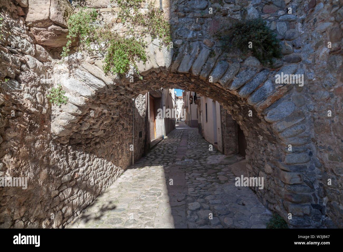 Sant Joan de les Abadesses, Catalonia, Spain. Ancient stone street village rural houses. Stock Photo