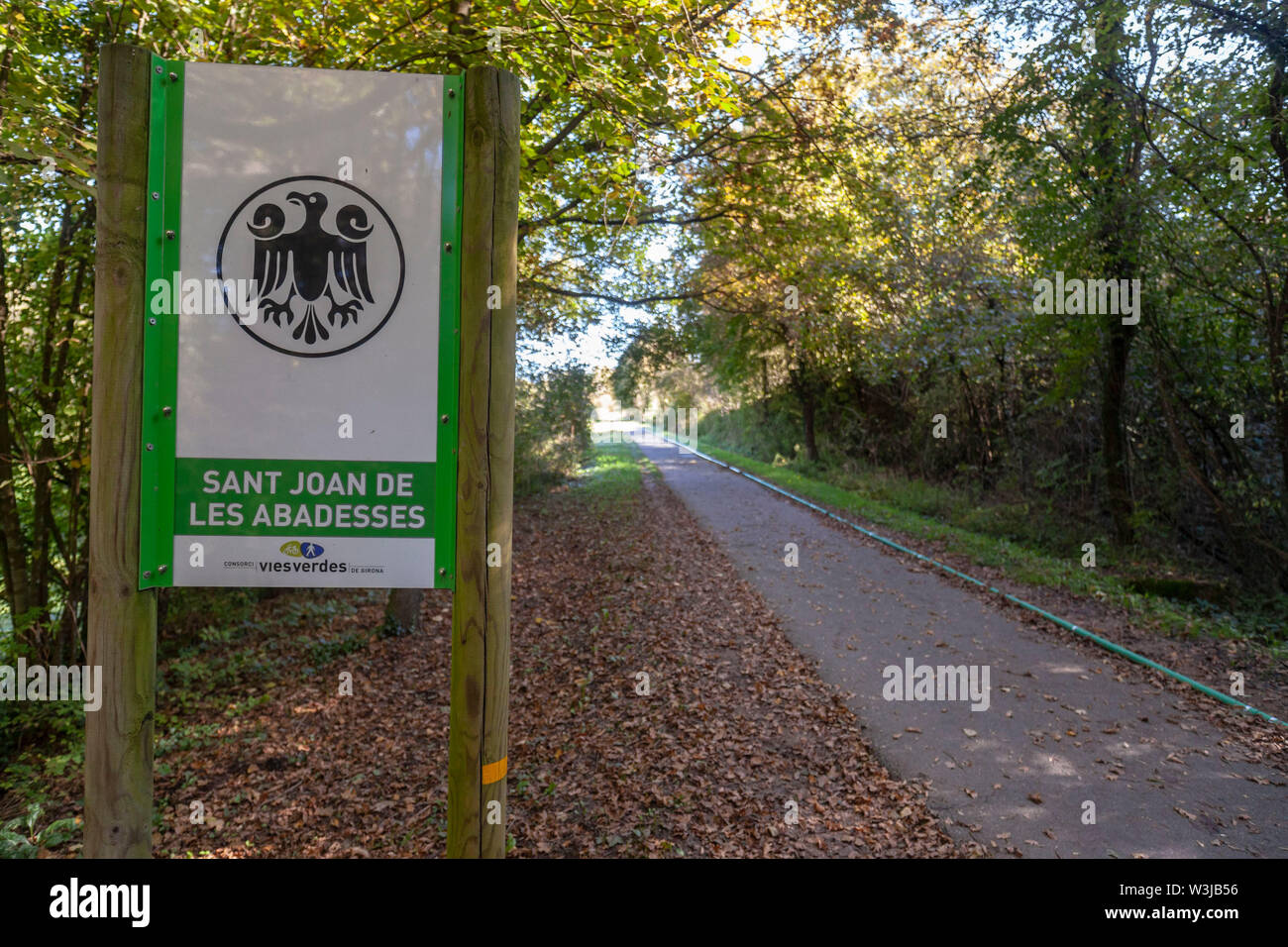 SANT JOAN DE LES ABADESSES,SPAIN- OCTOBER 25,2018: Ruta del Ferro, Iron and Coal Route, Old railway transformed in trail walk or bike ride. Villages o Stock Photo