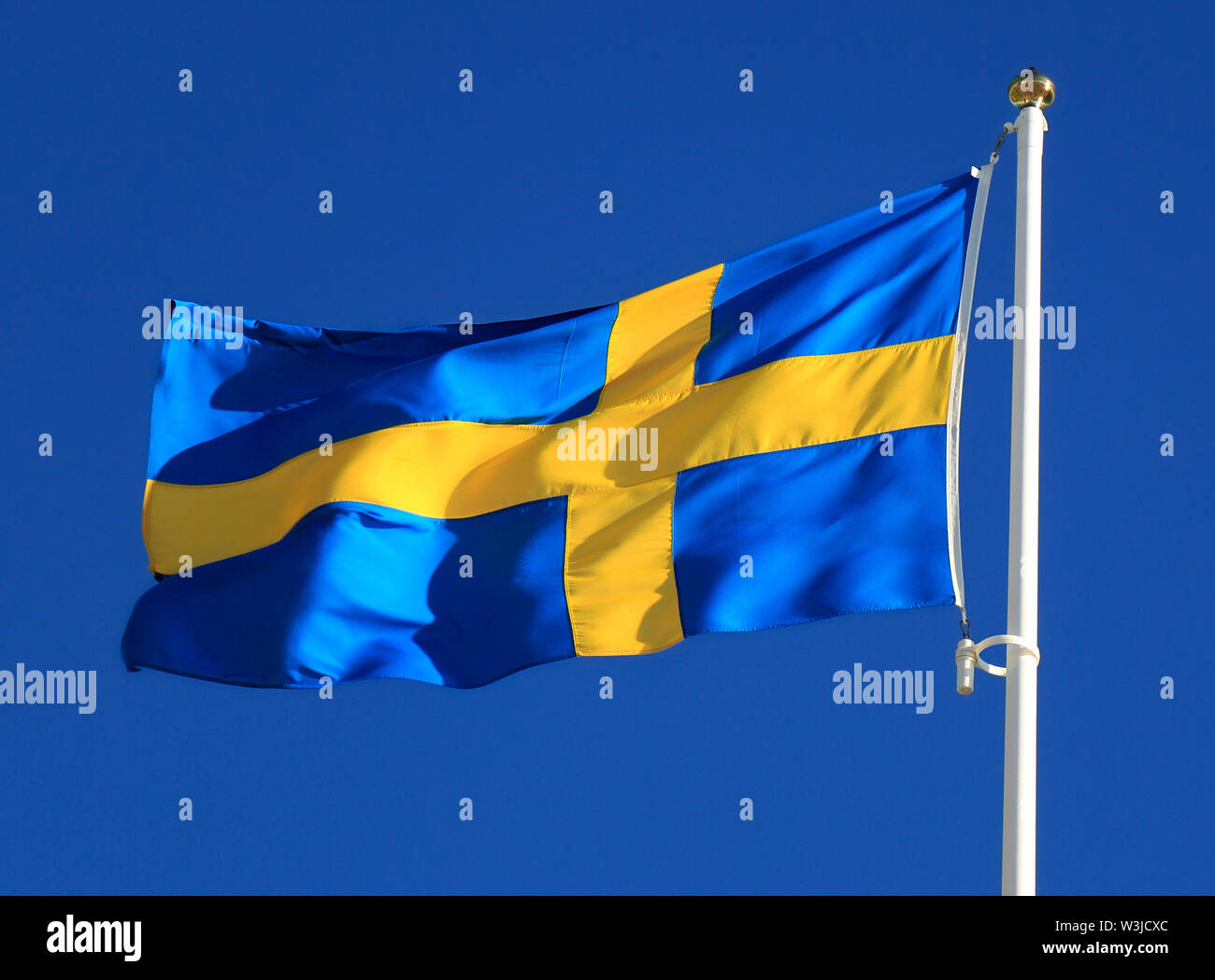 Sweden flag waving with the blue sky on the background Stock Photo