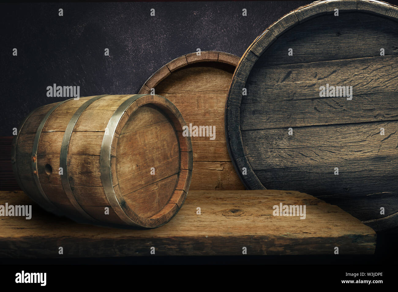 Beautiful old wooden barrels on a creative background Stock Photo - Alamy