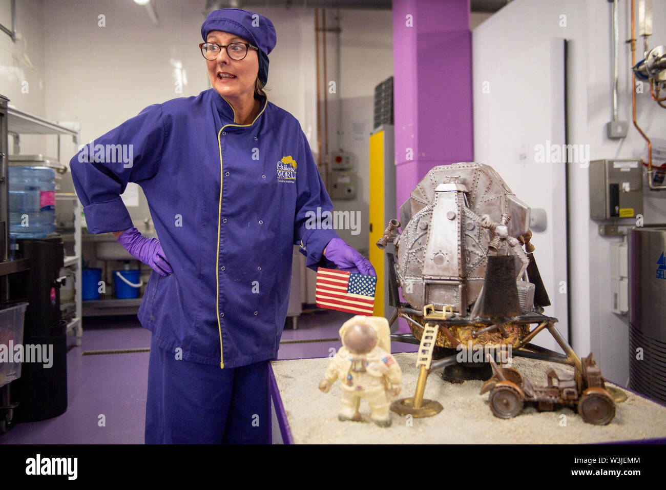Cadbury World chocolatier Dawn Jenks adds the finishing touches to the chocolate recreation of the Apollo 11 moon landing at Cadbury World in Birmingham, to mark 50 years to the day since the US mission to put men on the Moon lifted off. Stock Photo