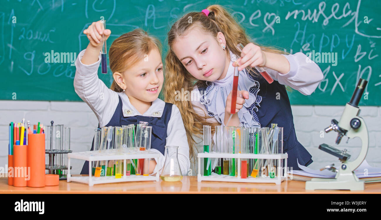 Chemistry is about reaction. Smart school children performing chemistry