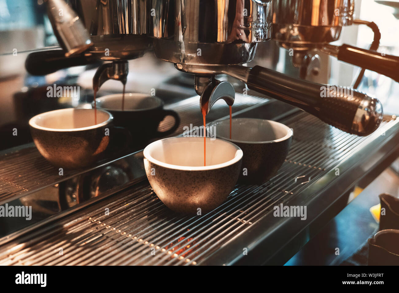 process of making two cups of coffee drink at the same time using professional coffee machine in cafe Stock Photo Alamy