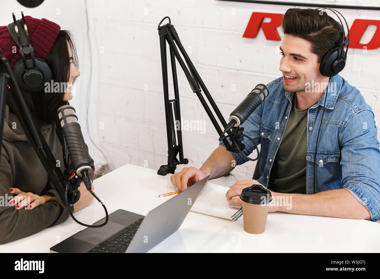 Two radio hosts moderating a live show for radio Stock Photo
