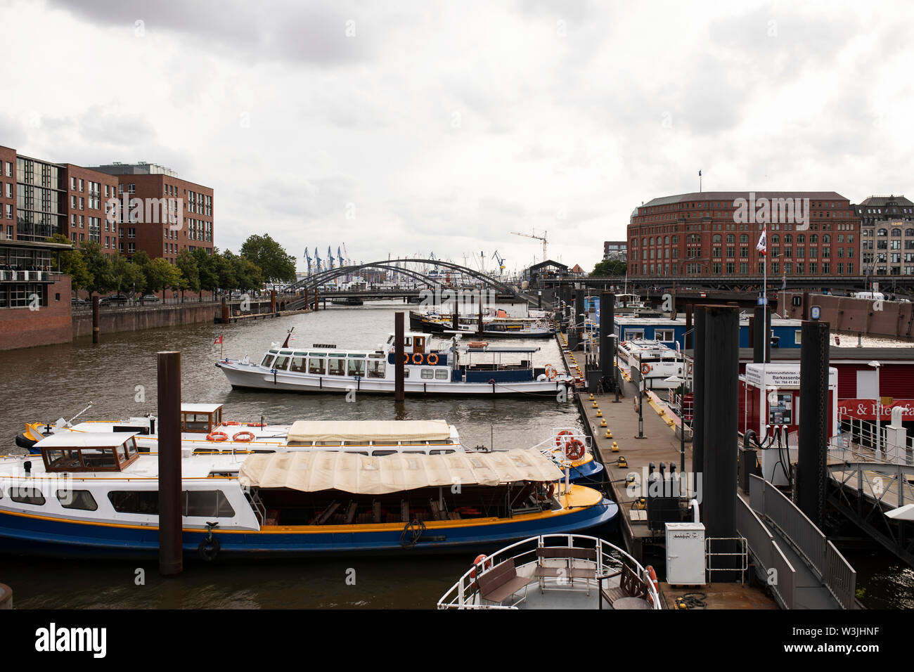 A view of boats in the Binnenhafen canal looking toward the Niederbaumbrücke bridge in the Hafencity neighborhood of Hamburg, Germany. Stock Photo