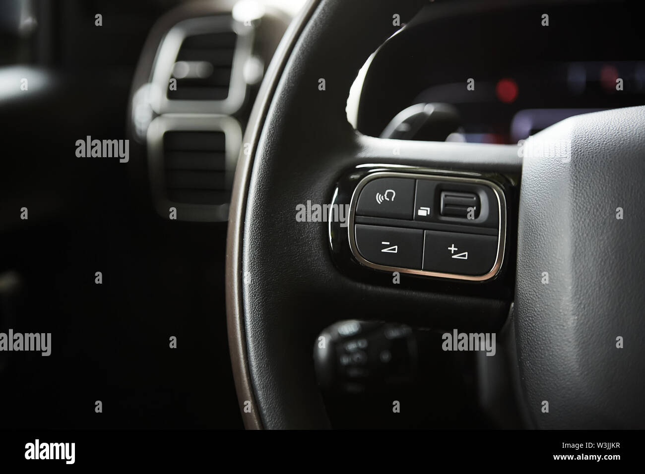 selective focus of steering wheel near gear shift handle in luxury car Stock Photo Alamy