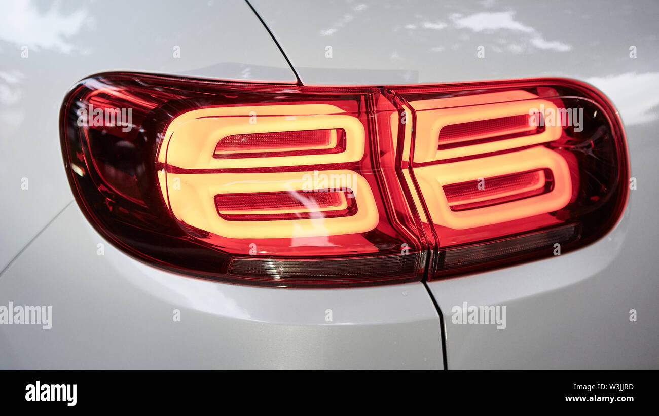 Back lights of white car. While flaming red Stock Photo Alamy