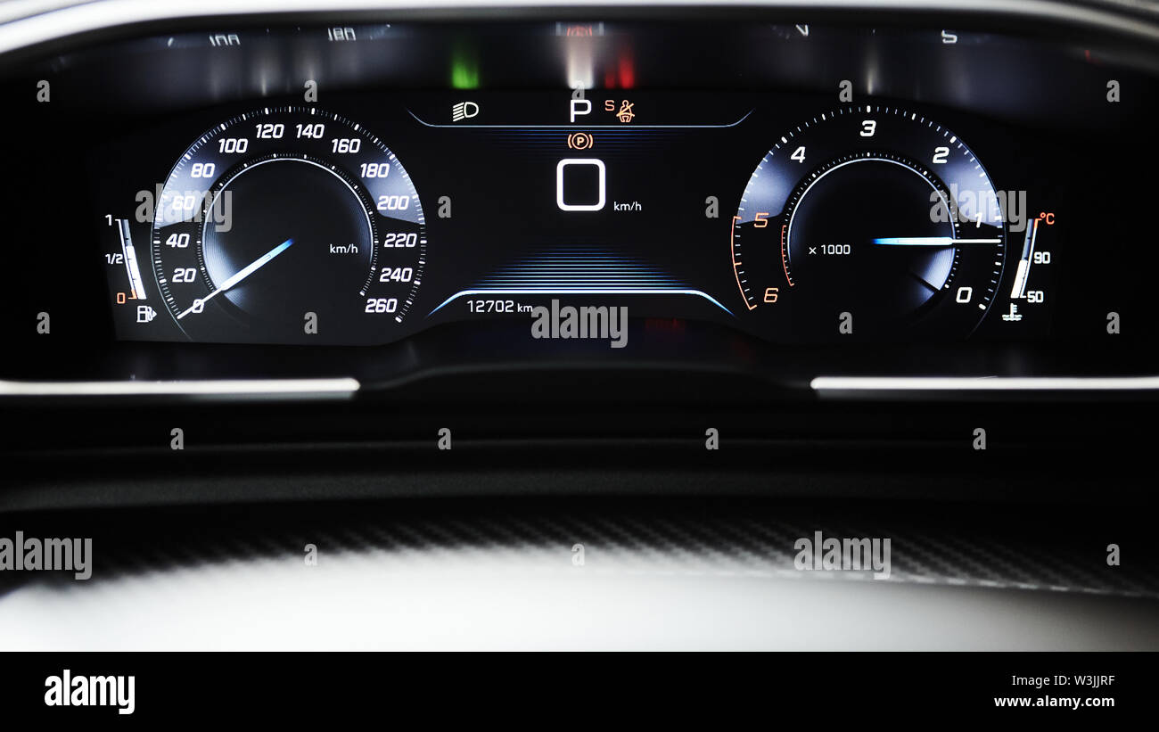 Car dashboard panel with speedometer, tachometer, odometer, fuel gauge