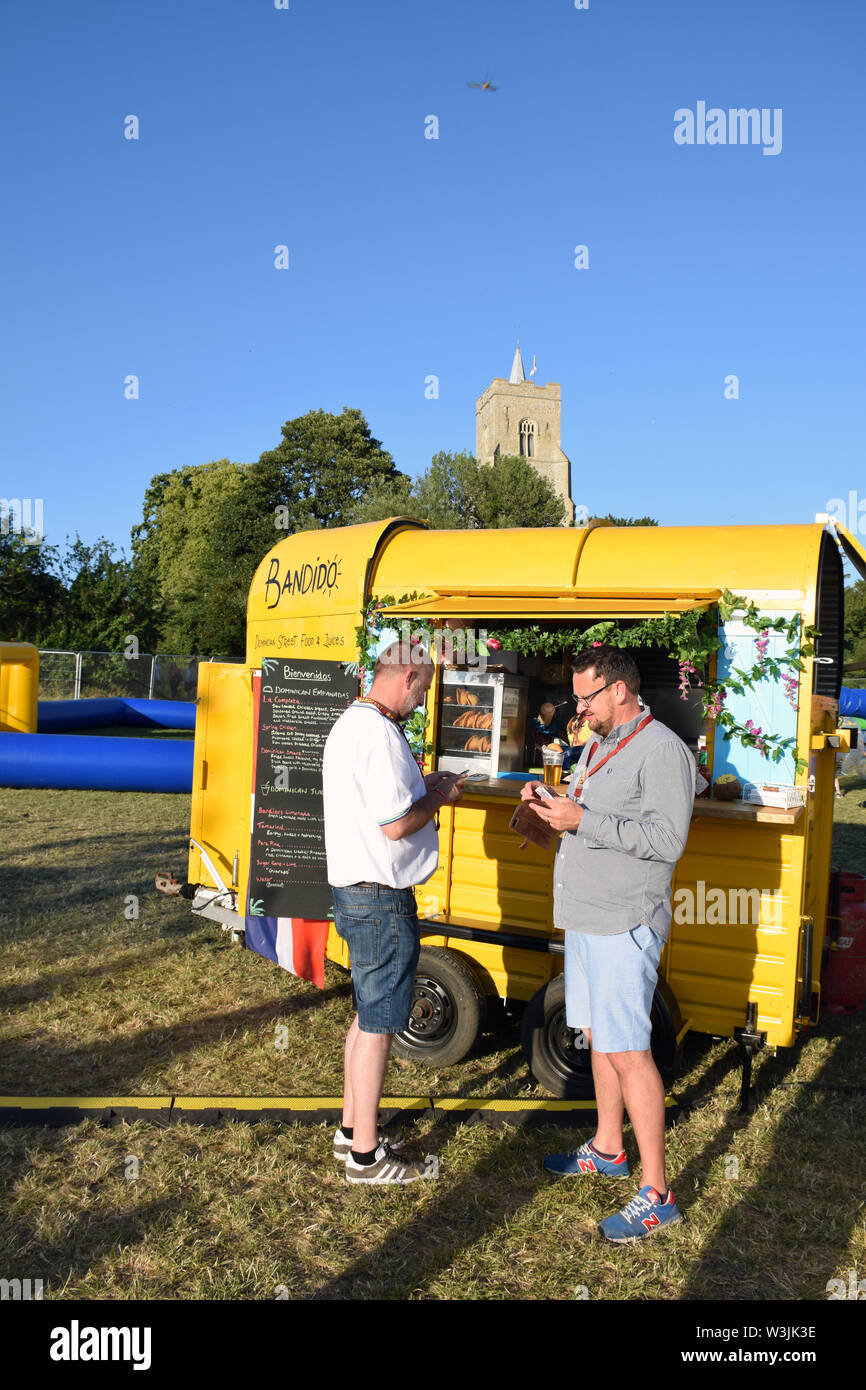 Dominican street food at Bardfest, a small music festival in Bardwell, Suffolk, UK July 2019 Stock Photo