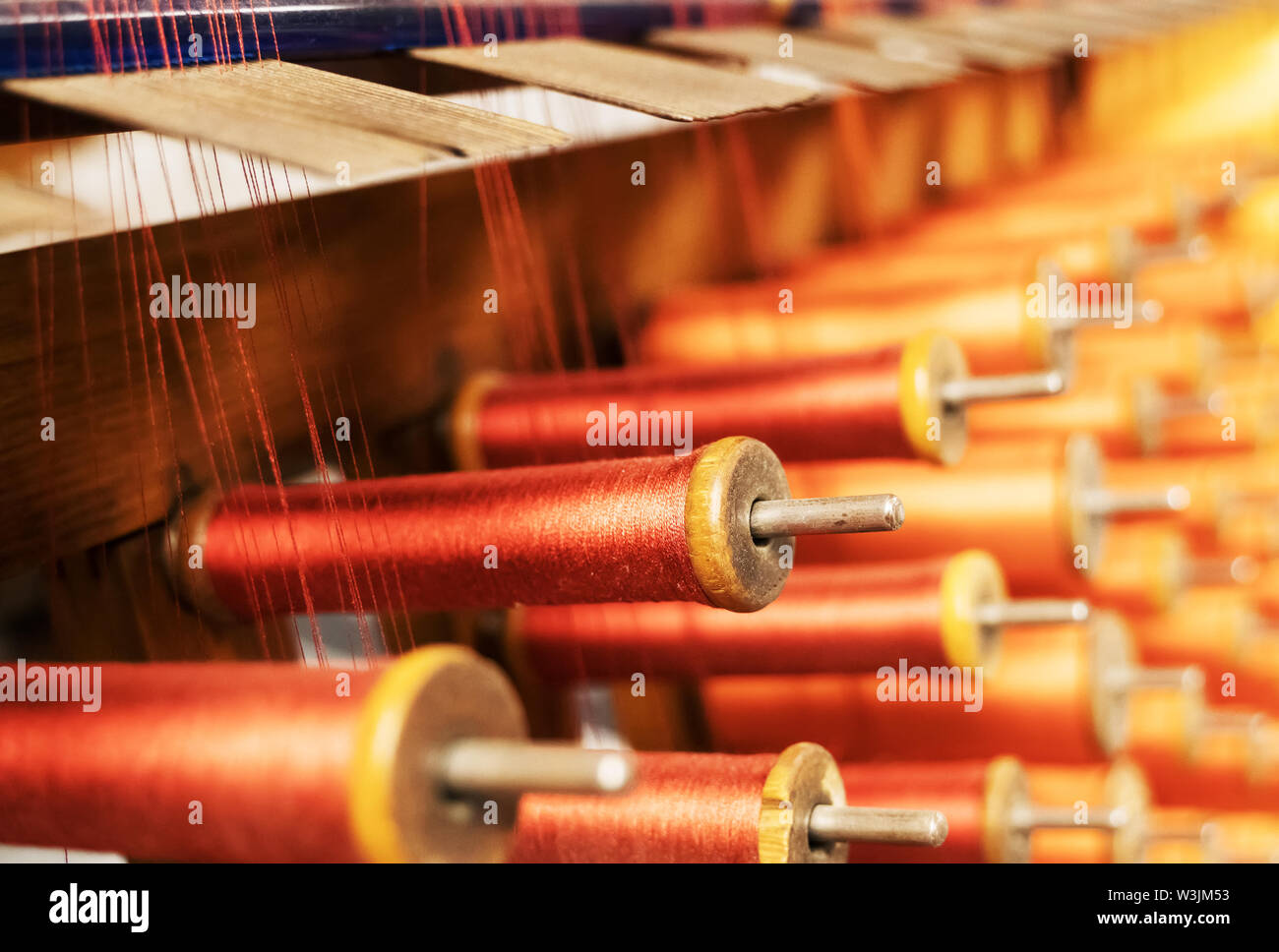 Many multi-colored spool of threads in a sewing factory Stock Photo - Alamy