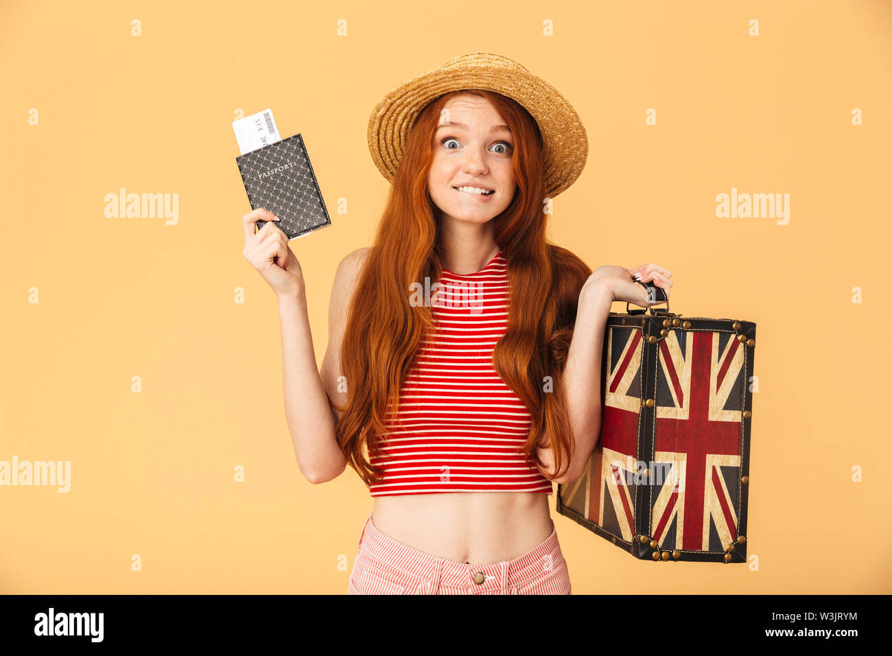 Image of a nervous hopeful cute young pretty redhead woman posing