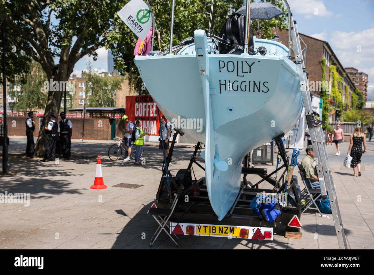 London, UK. 16 July, 2019. The Polly Higgins, a vessel named by climate activists from Extinction Rebellion after the noted eco-lawyer who campaigned for ecocide to be made a crime, is parked close to the camp on Waterloo Millennium Green on the second day of their ‘Summer uprising’, a series of events intended to apply pressure on local and central government to address the climate and biodiversity crisis. Credit: Mark Kerrison/Alamy Live News Stock Photo