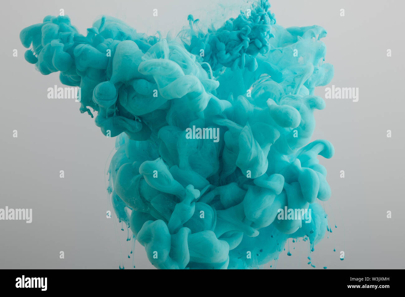 turquoise paint splash isolated on grey Stock Photo - Alamy