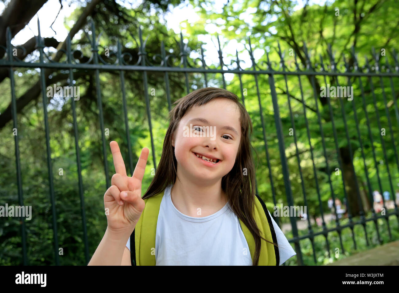 Portrait of little girl smiling outside Stock Photo - Alamy