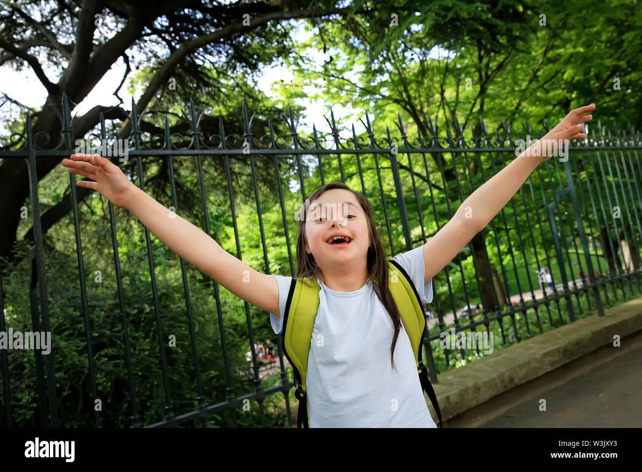 Portrait of little girl smiling outside Stock Photo - Alamy