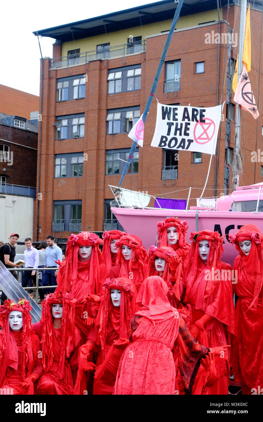 Bristol, UK, 16th July 2019.  Red Brigade on Day 2 of the Extinction rebellion movement summer uprising, the occupation of Bristol Bridge continues. The protest is to raise awareness of the speed of climate change and the lack of action to stop it. The protestors have worked with local agencies to ensure a safe and peaceful protest, police are present and diversions in place. Further occupations are planned throughout the city this week. Credit: Mr Standfast / Alamy Live News Stock Photo