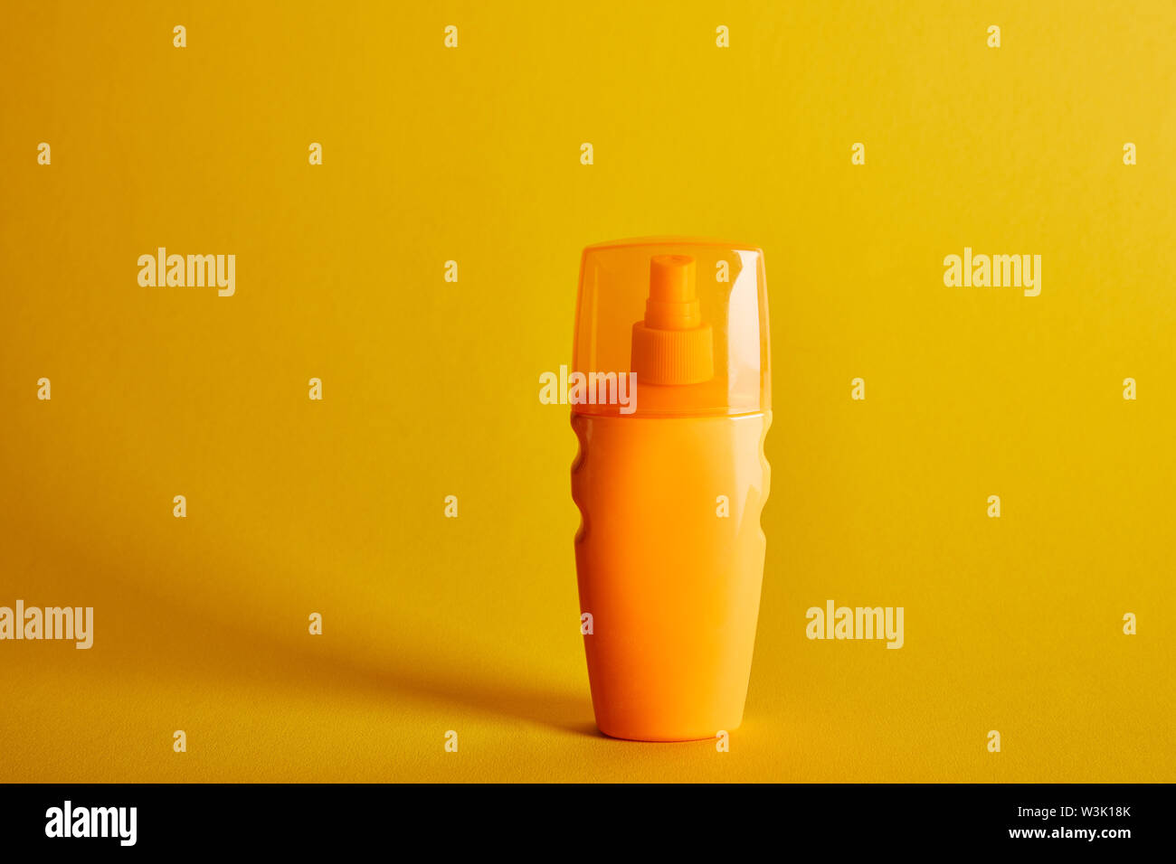 Download Sunscreen In Orange Bottle On Dark Yellow Background Stock Photo Alamy Yellowimages Mockups