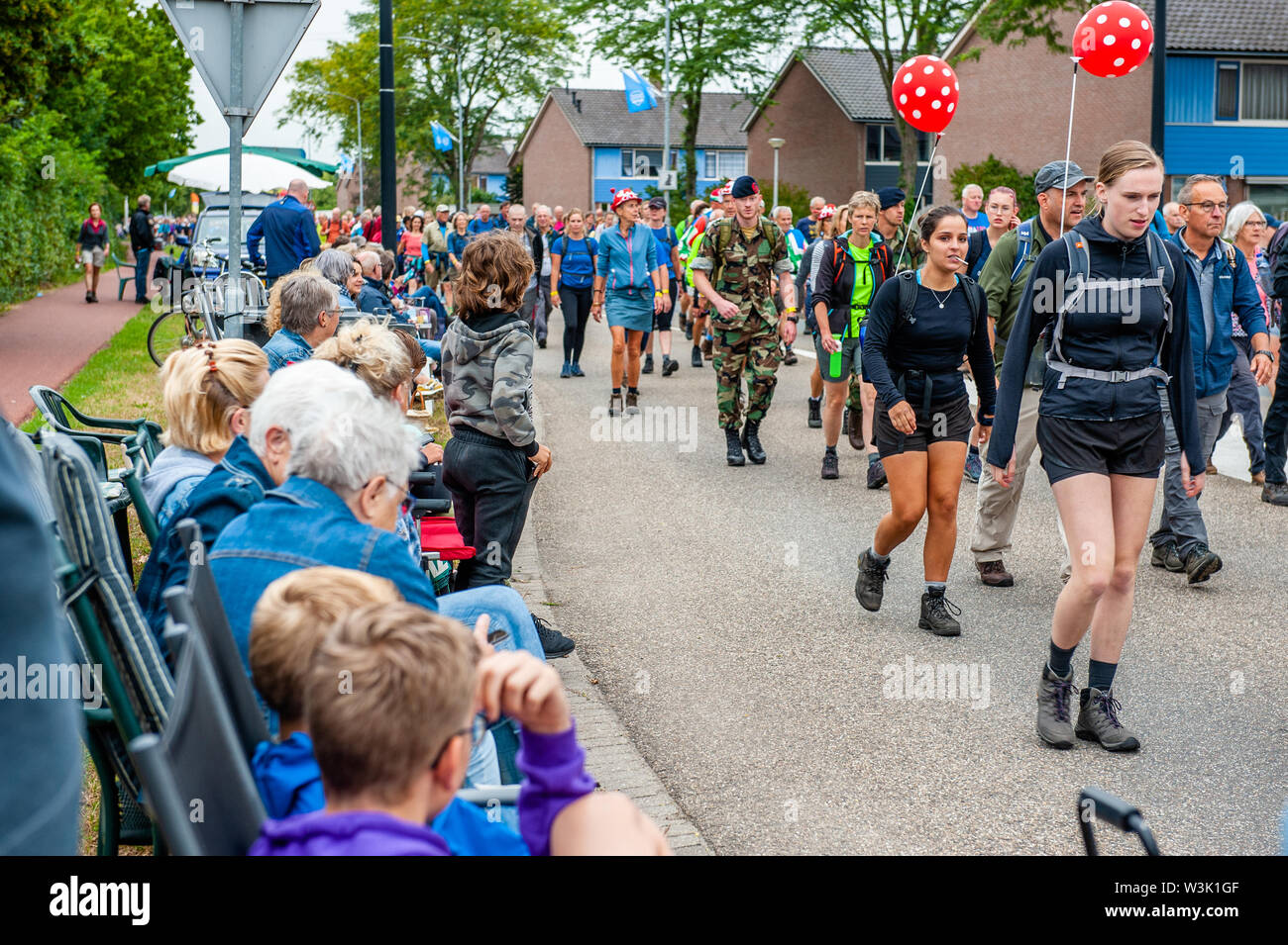 Spectators look on as walkers during the event.The Four Days Marches are a walking achievement event for four consecutive days, in which annually of thousands walkers are participating. On those