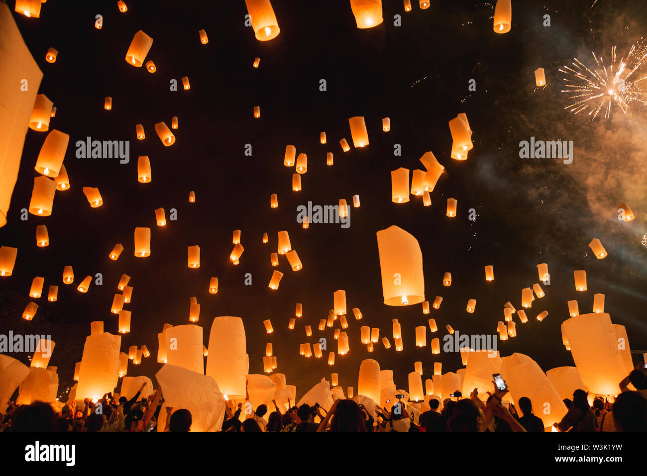 Loy krathong festival, thai new year party with floating lanterns release in the night sky Stock Photo