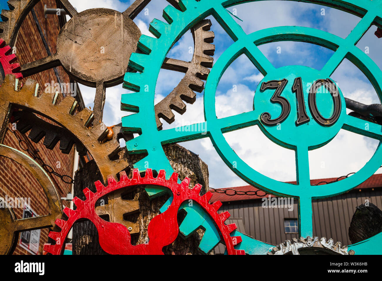 Decorative display of gear wheels at the River Arts District, Asheville, North Carolina, USA. Stock Photo