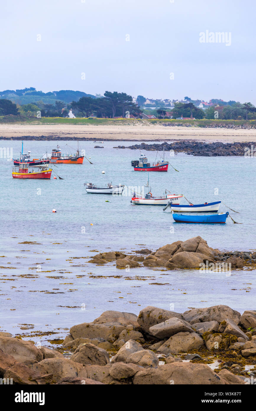 Fishing boats moored in Grand Havre viewed from Rousse, Guernsey