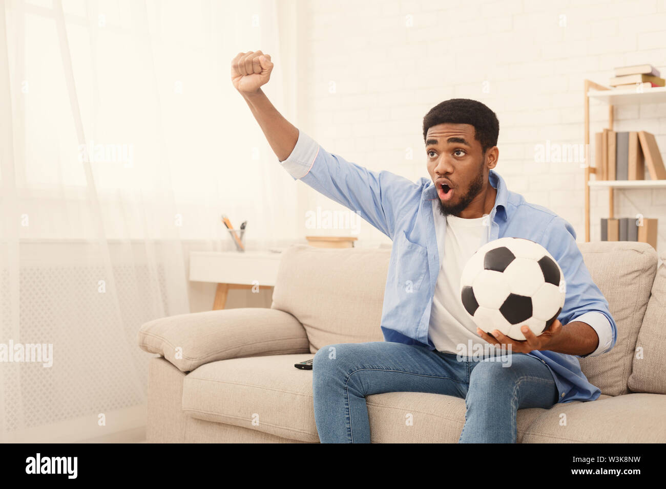 Excited watching tv sport hires stock photography and images Alamy