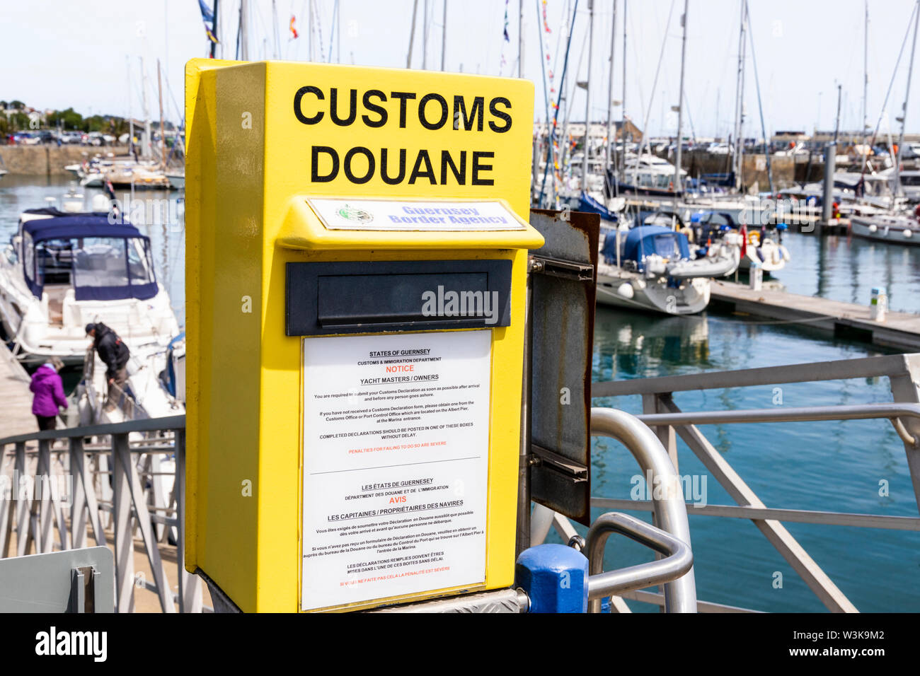 A Guernsey Border Agency collection box for customs declarations in the harbour at St Peter Port, Guernsey, Channel Islands UK Stock Photo