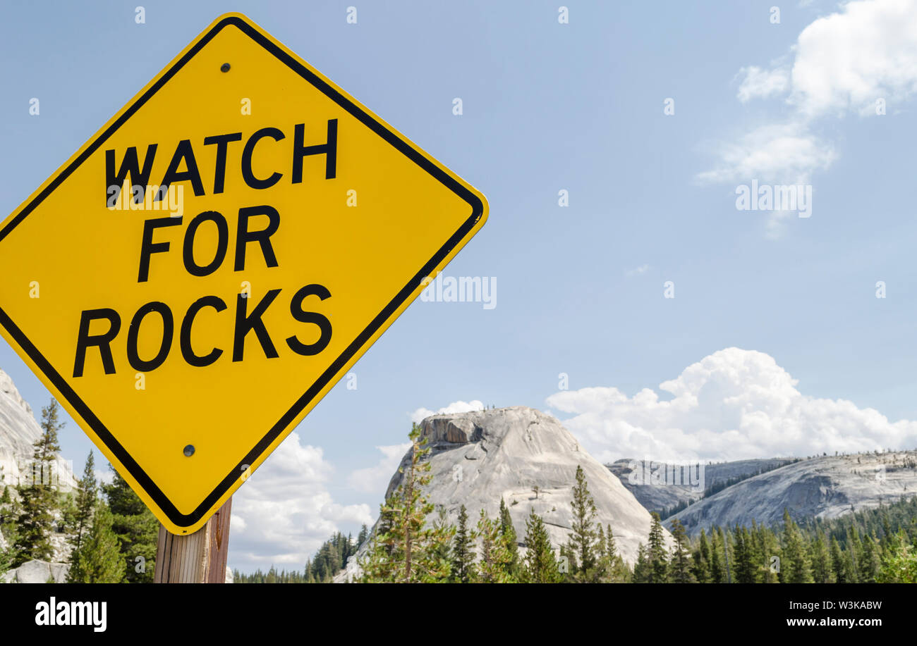 Watch For Rocks sign along State Route 120/Tioga Road. Yosemite National  Park, California, USA Stock Photo - Alamy
