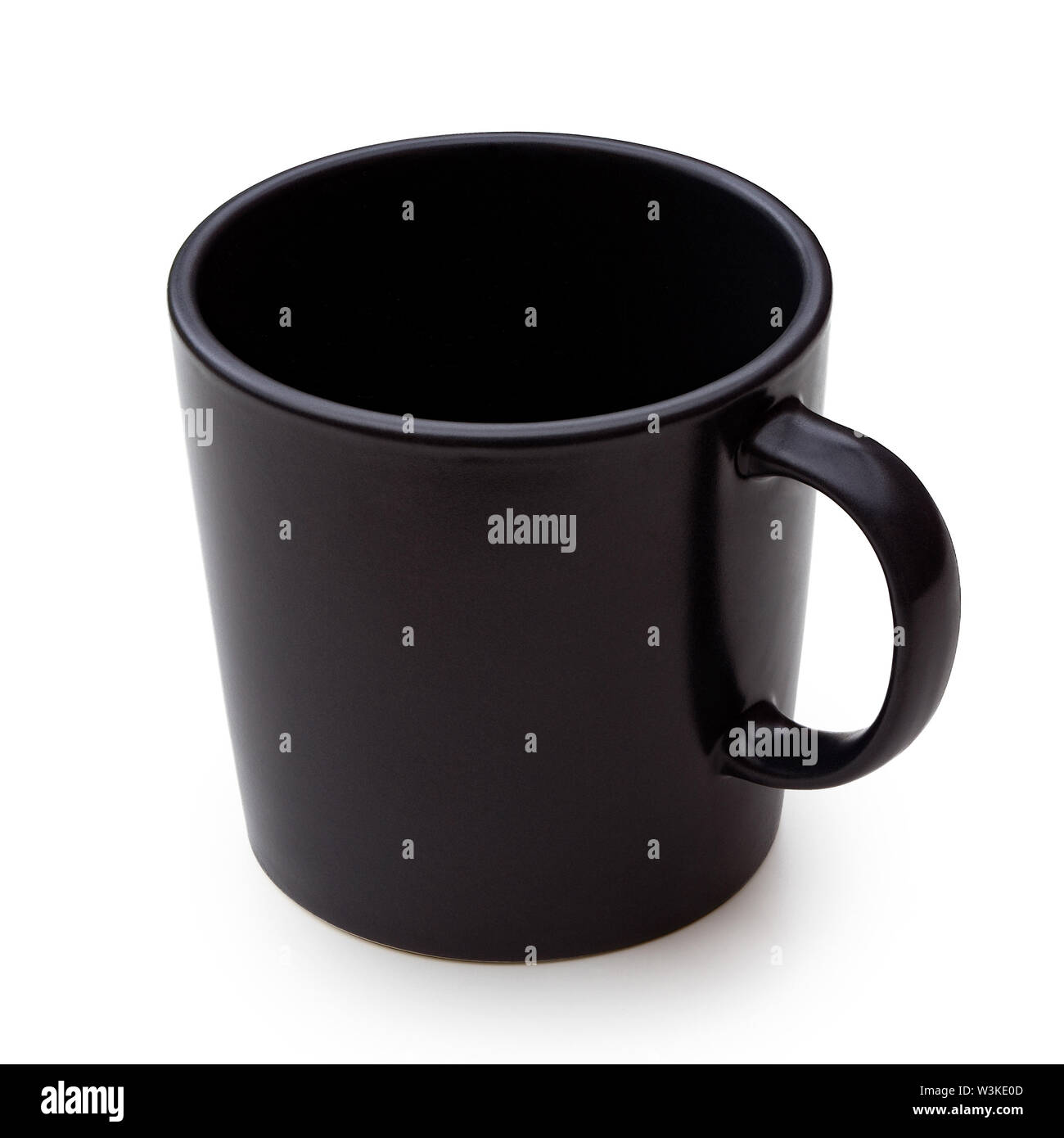 Empty black ceramic mug isolated on white. Stock Photo