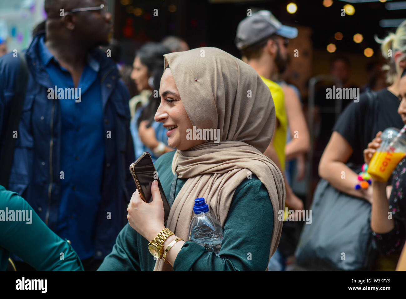 Arabic young woman on Oxford Street smiling and looking very happy Stock Photo