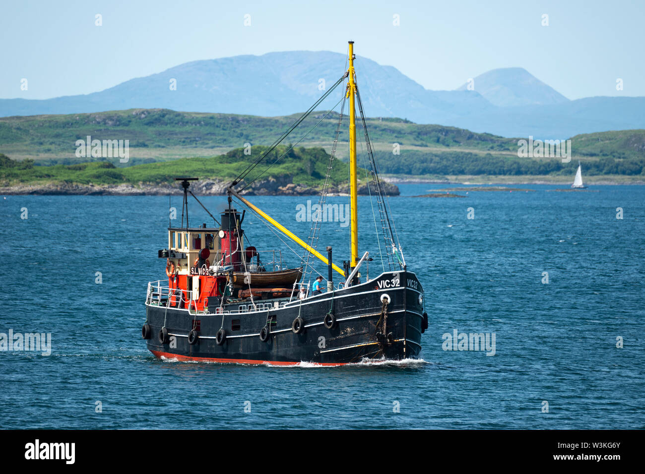 Clyde puffer VIC32, one of the last seagoing coal-fired steam lighters,  approaching Crinan Village in Argyll and Bute, Scotland, UK Stock Photo -  Alamy