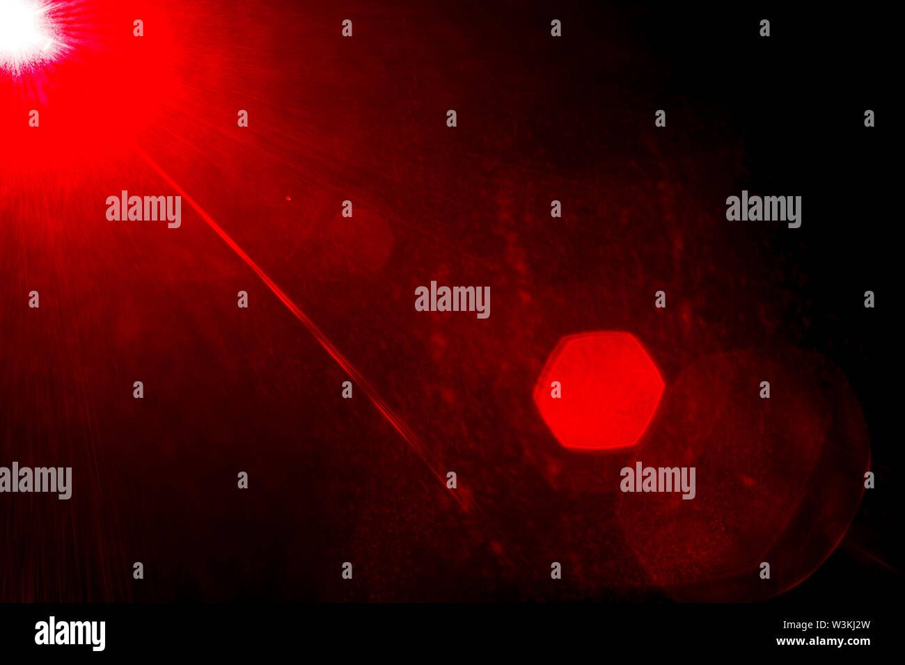 Camera lens flare by laser light create hexagons of objective iris ...