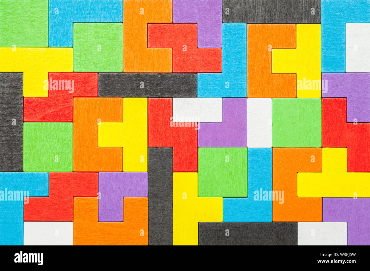Colorful Geometric Shape Wood Puzzle Blocks Background. Stock Photo