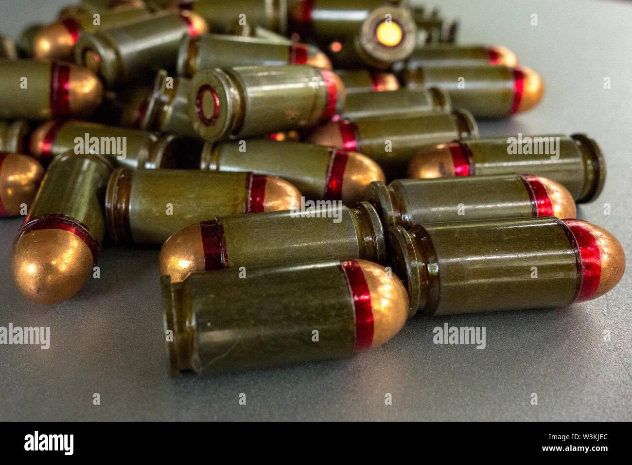 Cartridges bulk close up images. Bullets in shells for gun are piled