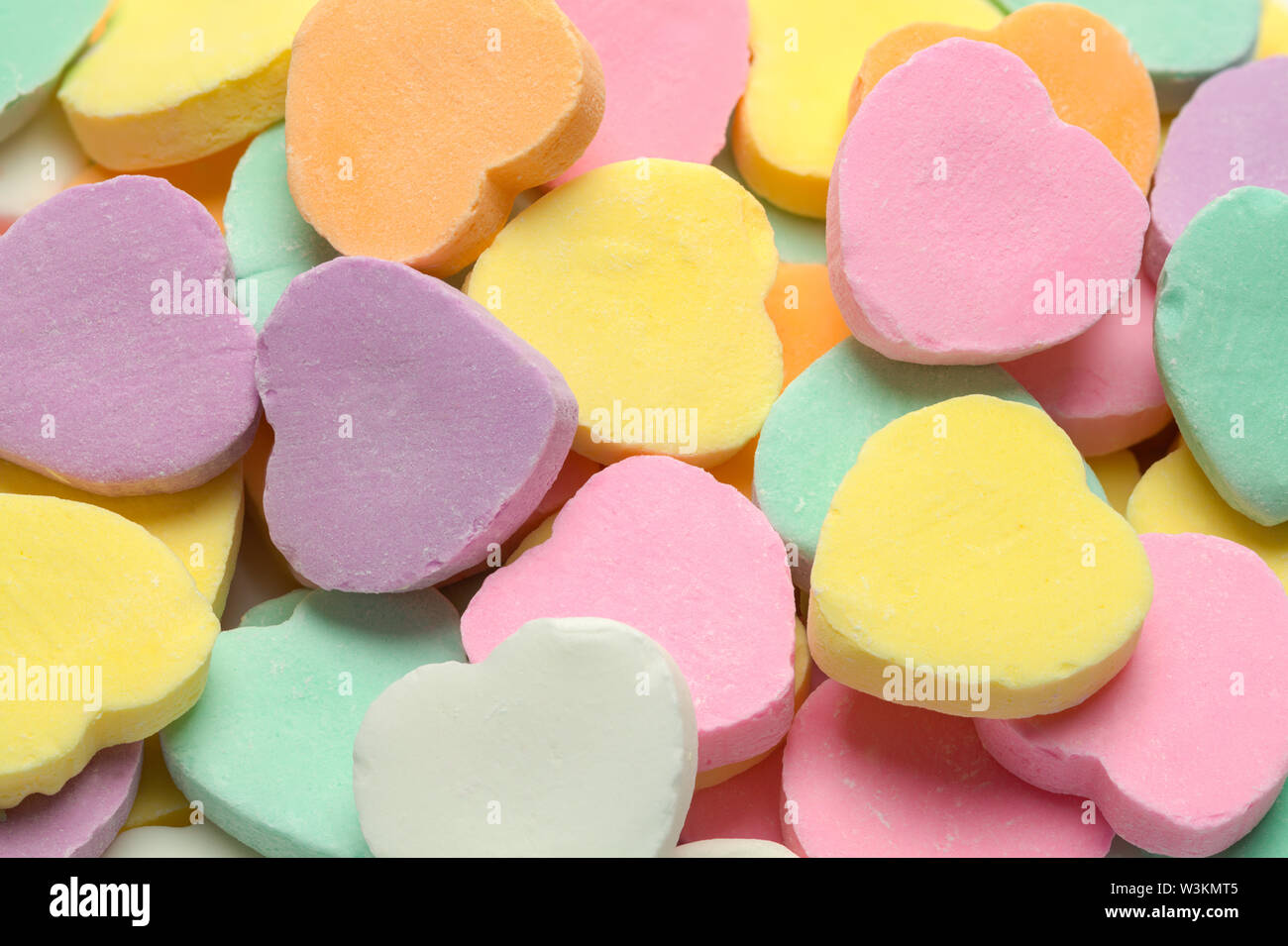 Blank Valentines Candy Heart Pile Close Up Background. Stock Photo