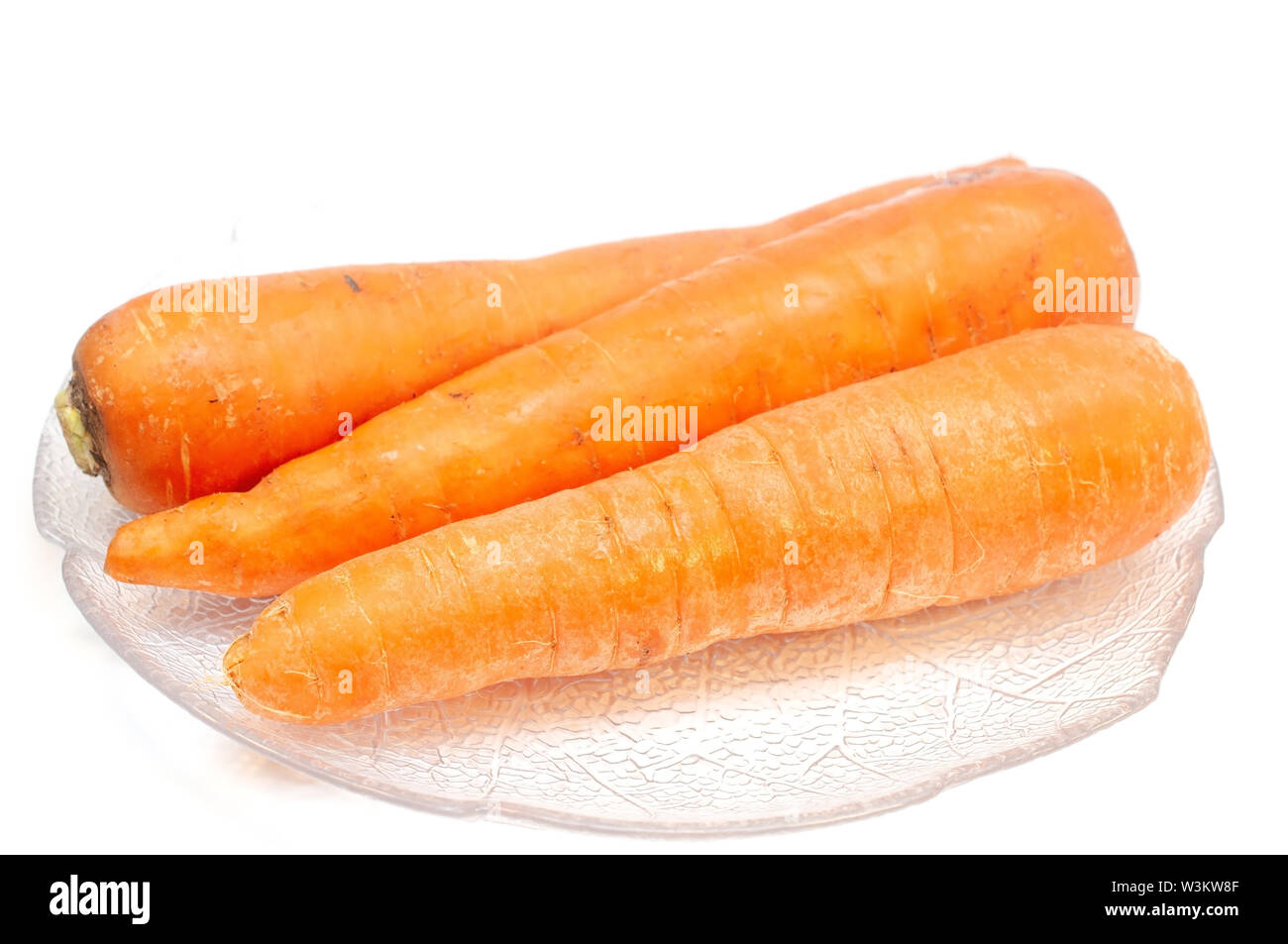 Carrots on a plate isolated on white Stock Photo