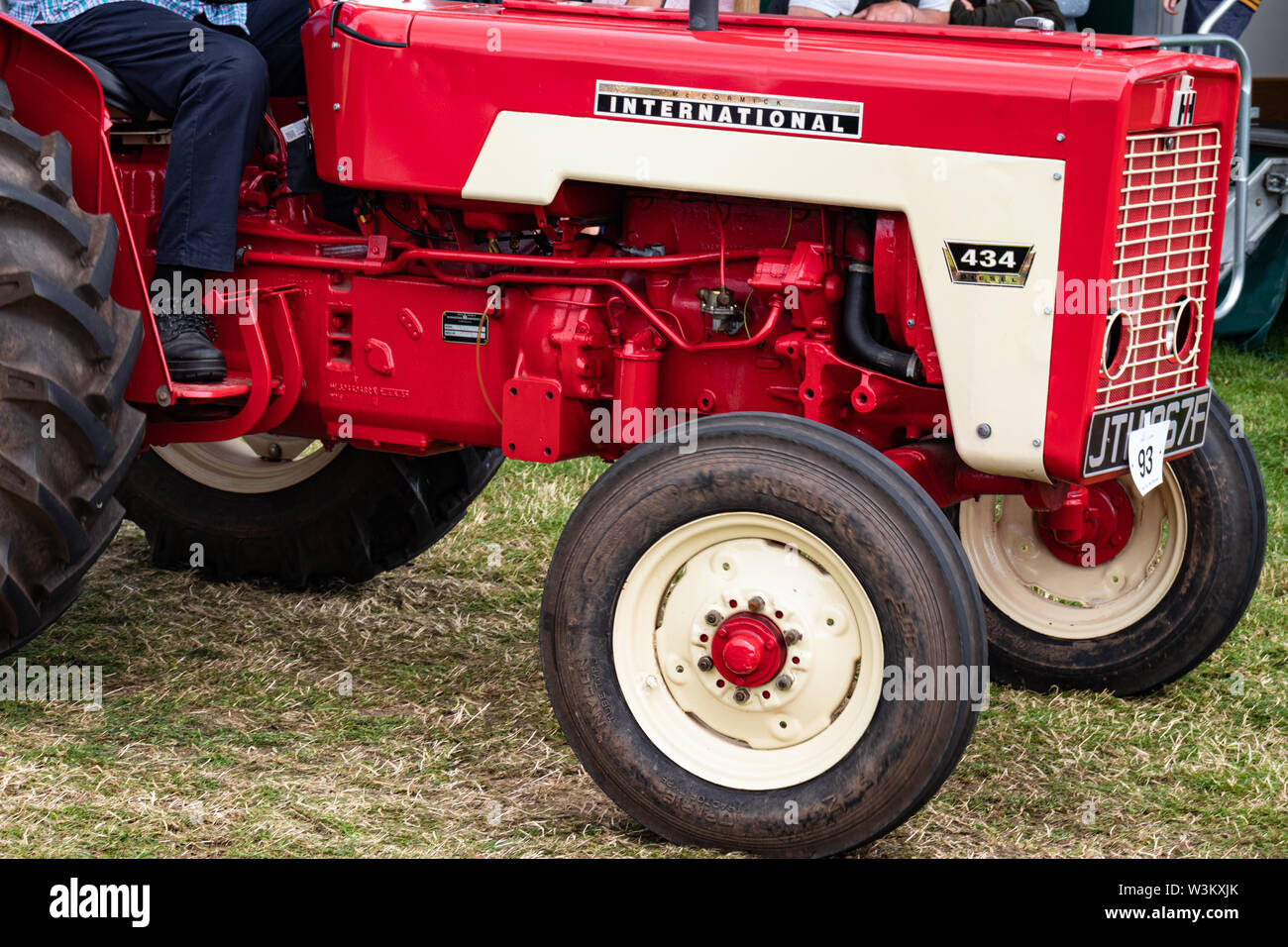 Vintage Green and Red Historic Restored Working Tractors at a Country