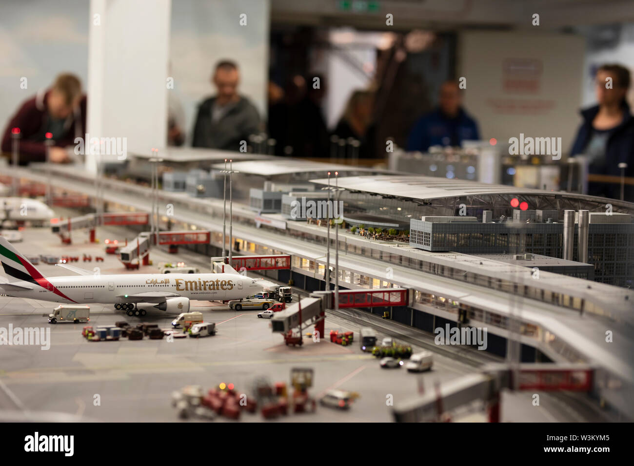 An Emirates plane at the terminal of the working airport at the model railway exhibit Miniatur Wunderland in Hamburg, Germany. Stock Photo