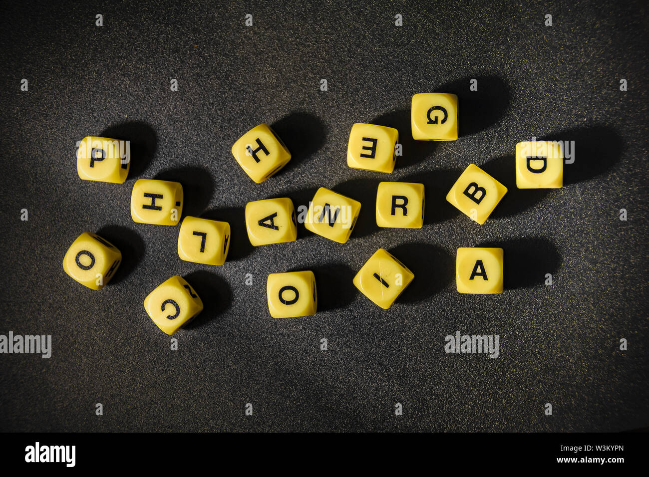 Reading or learning conceptual background with letters game cubes over black background Stock Photo