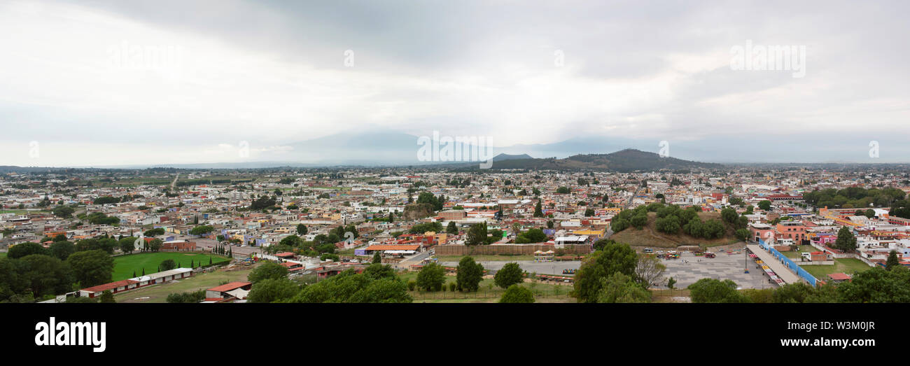 Panoramic views over Cholula, the magic town (Pueblo Mágico) shot from 'Nuestra Señora de los Remedios' church. Near Puebla, Mexico. Jun 2019 Stock Photo
