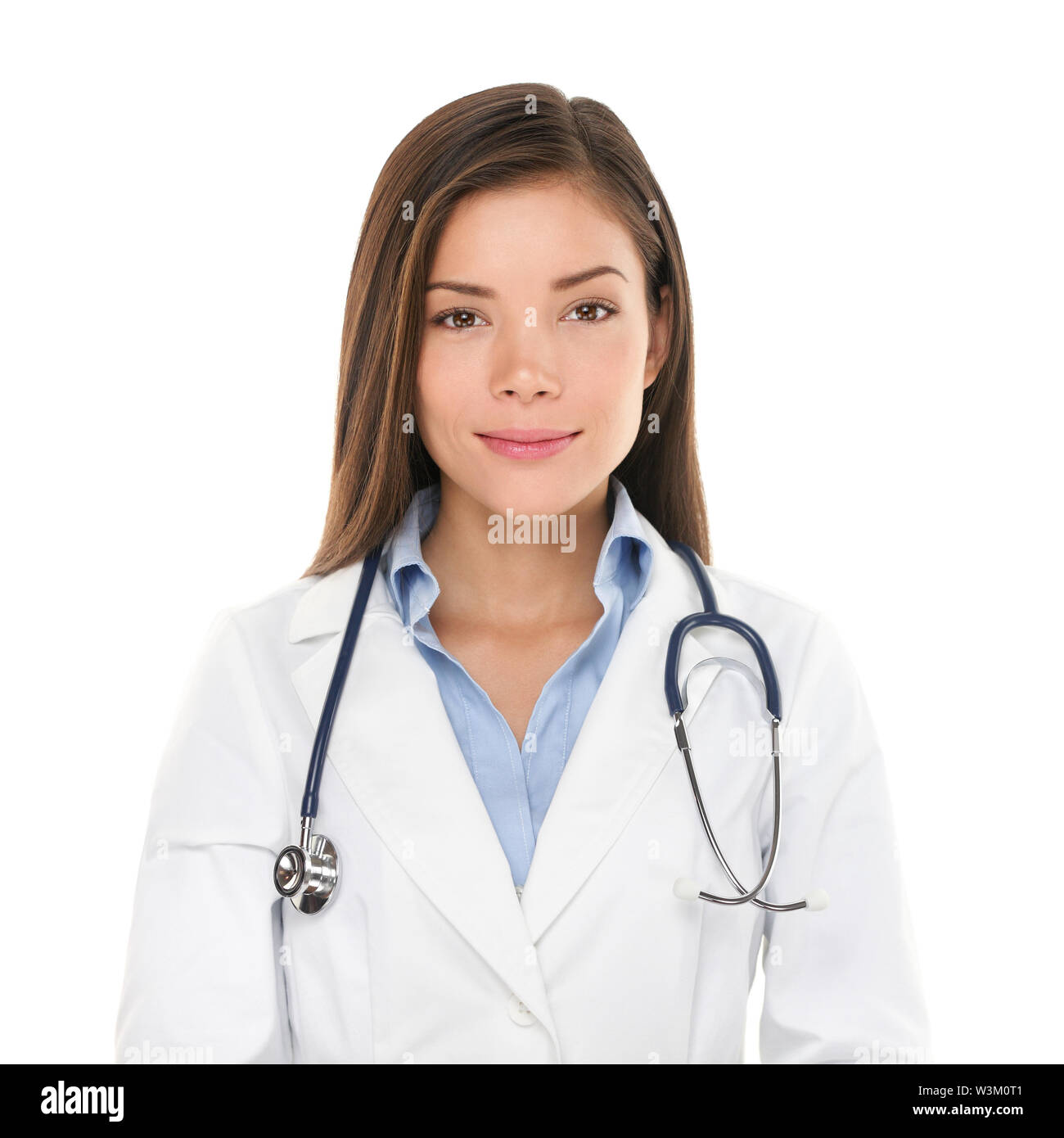 Medical people: Young asian doctor woman. Female medical doctor smiling portrait. Multiracial Asian / Caucasian woman medical professional isolated on white background. Stock Photo