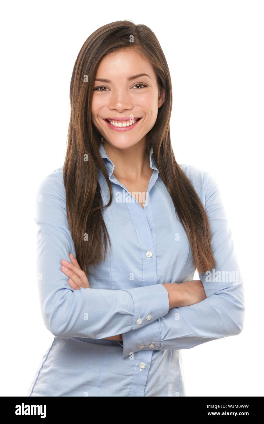 Asian businesswoman. Casual portrait of beautiful confident multi-ethnic Asian Chinese / Caucasian female businessperson smiling isolated on white background in studio. Young professional in her 20s. Stock Photo