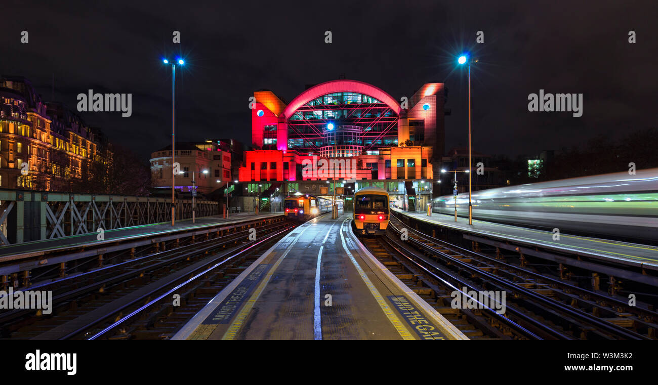 South Eastern trains class 465 and 375 electric trains at London Charing Cross station at night with a third train departing Stock Photo