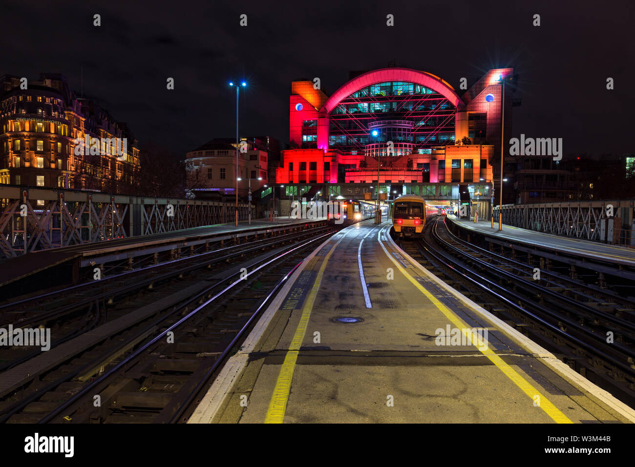 South Eastern trains class 465 and 375 electric trains at London Charing Cross station at night Stock Photo